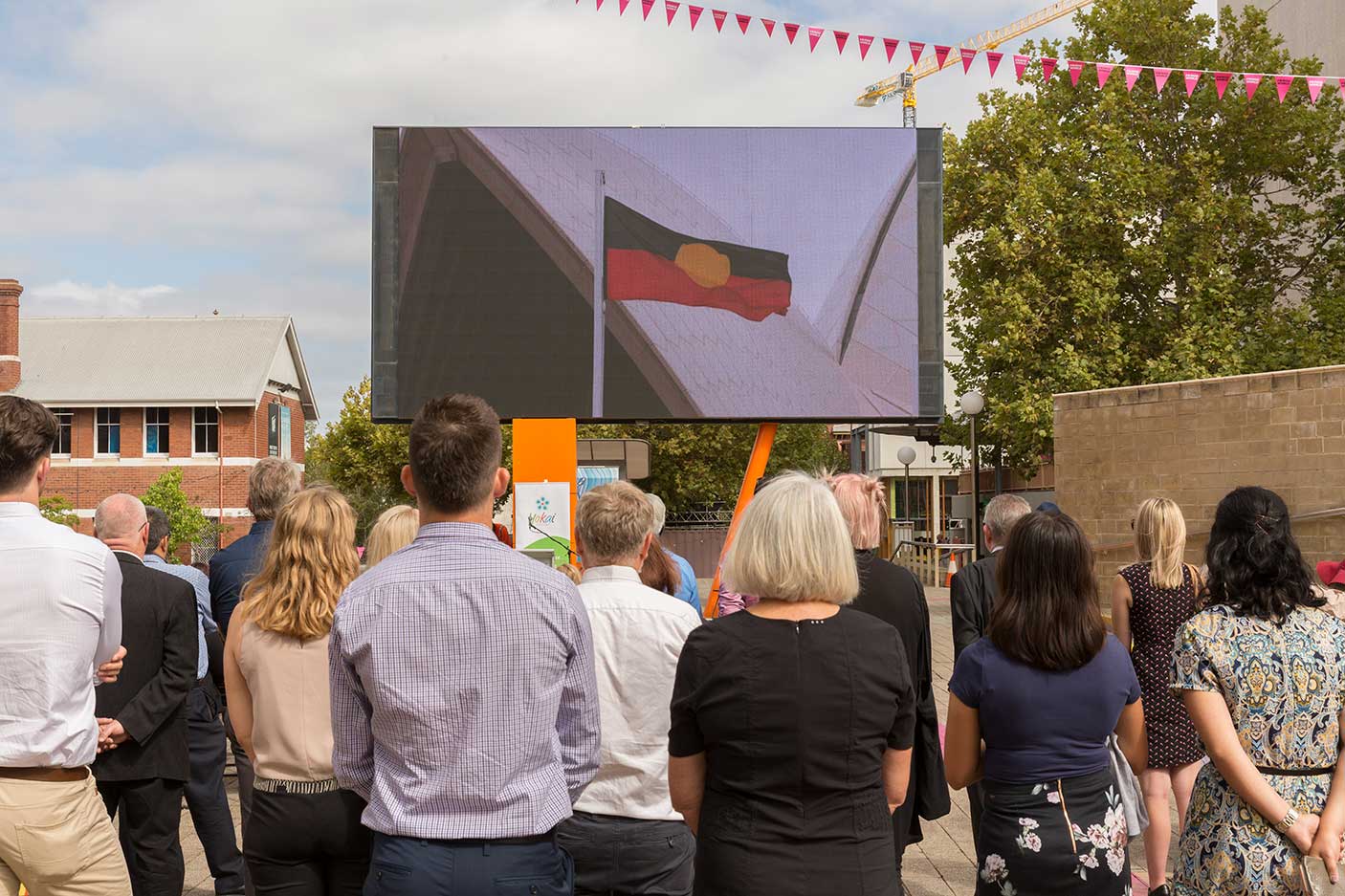 People watching a large screen in Perth Cultural Centre