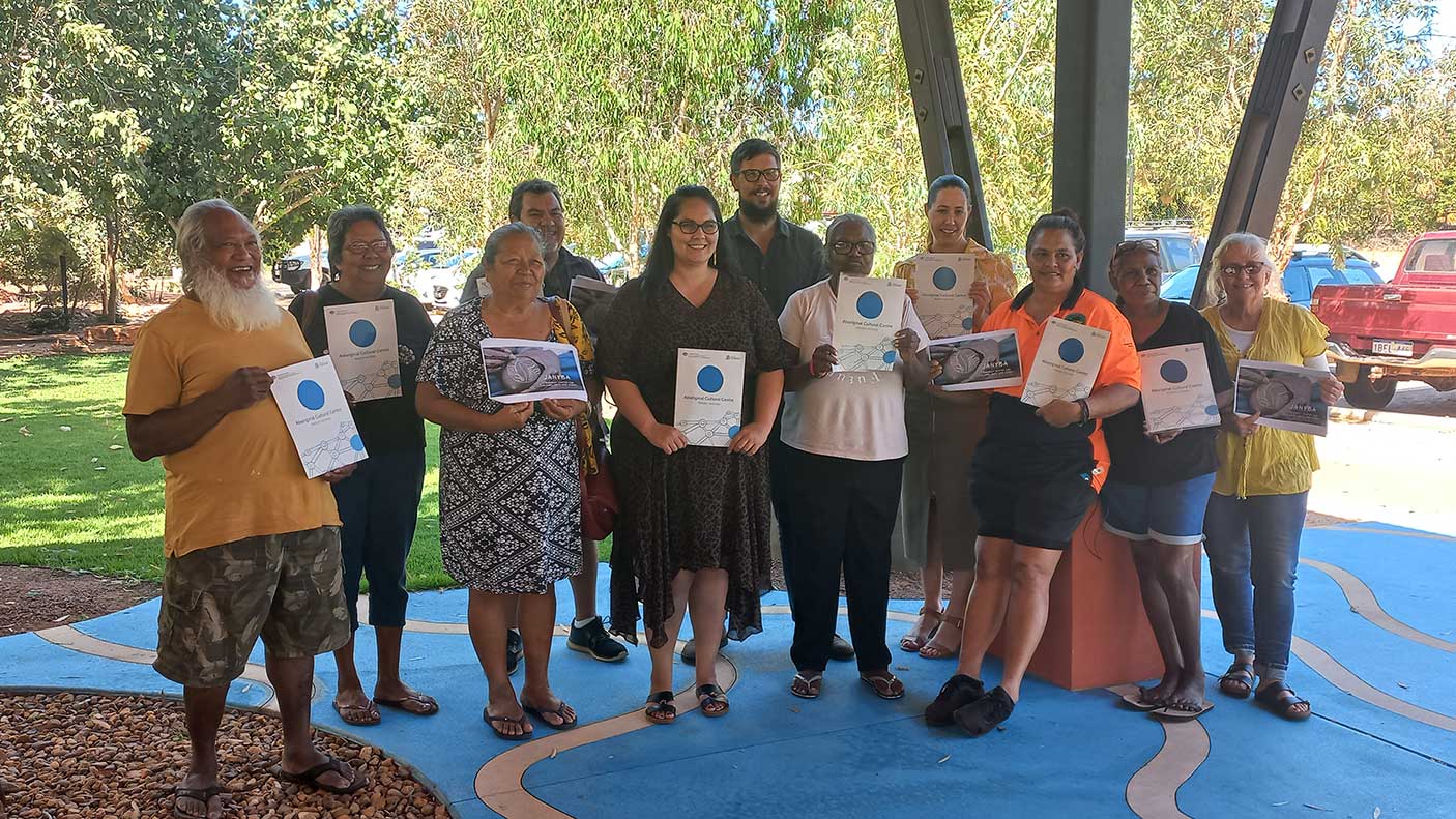 A group of people holding a certificate in regional WA
