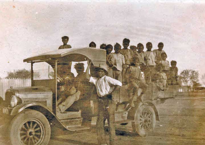 People on an old truck