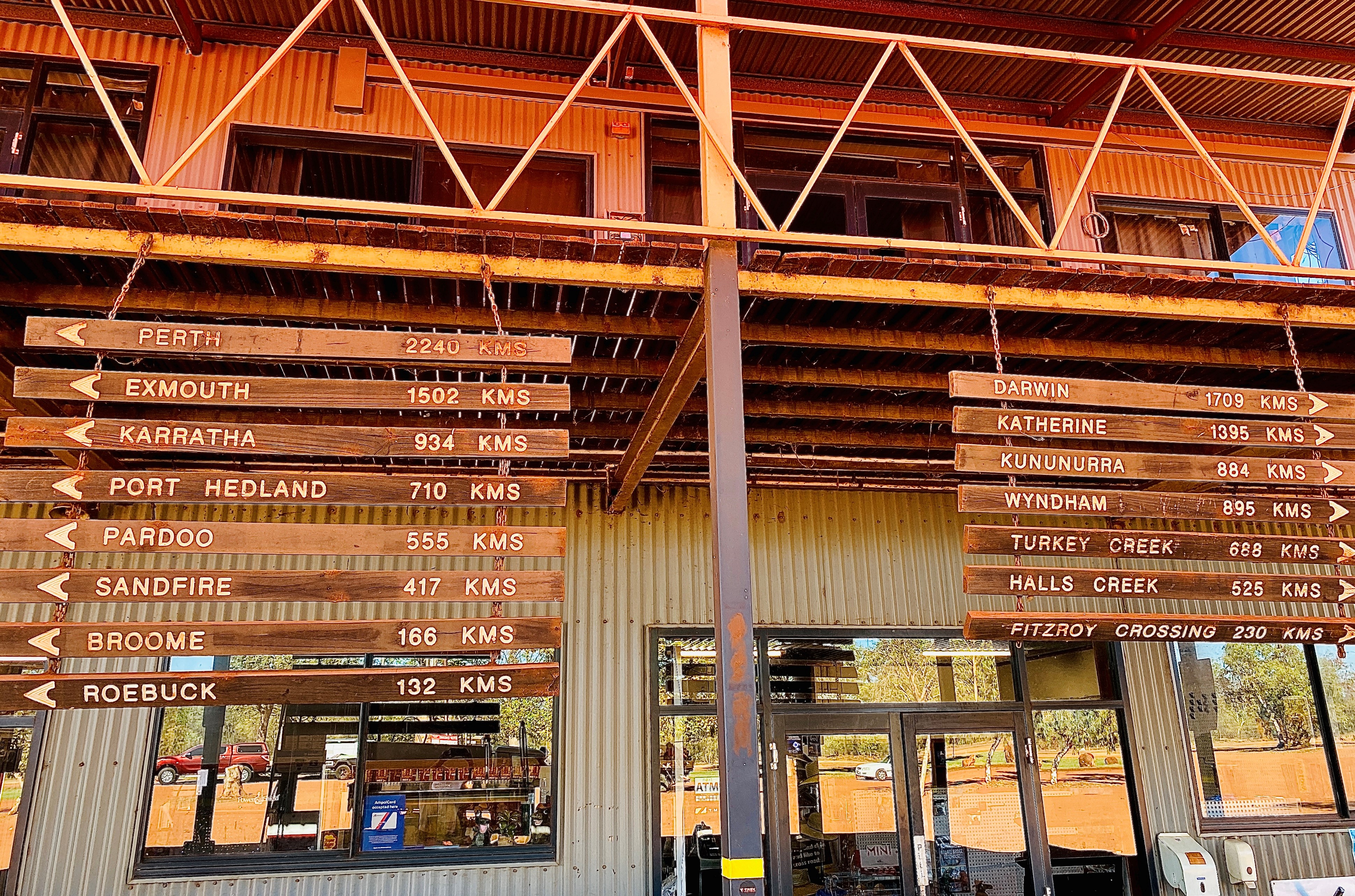 (Image two: roadhouse sign between the Shire of Broome and the Shire of Derby)