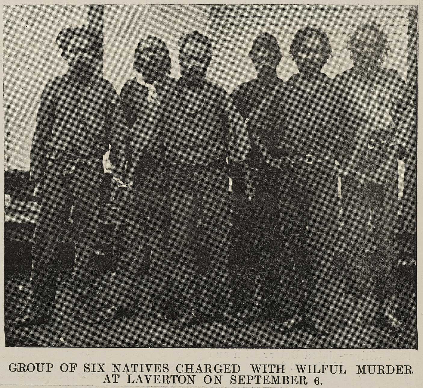 Group of Aboriginal men from the North-east Goldfields in chains, awaiting trial in Kalgoorlie