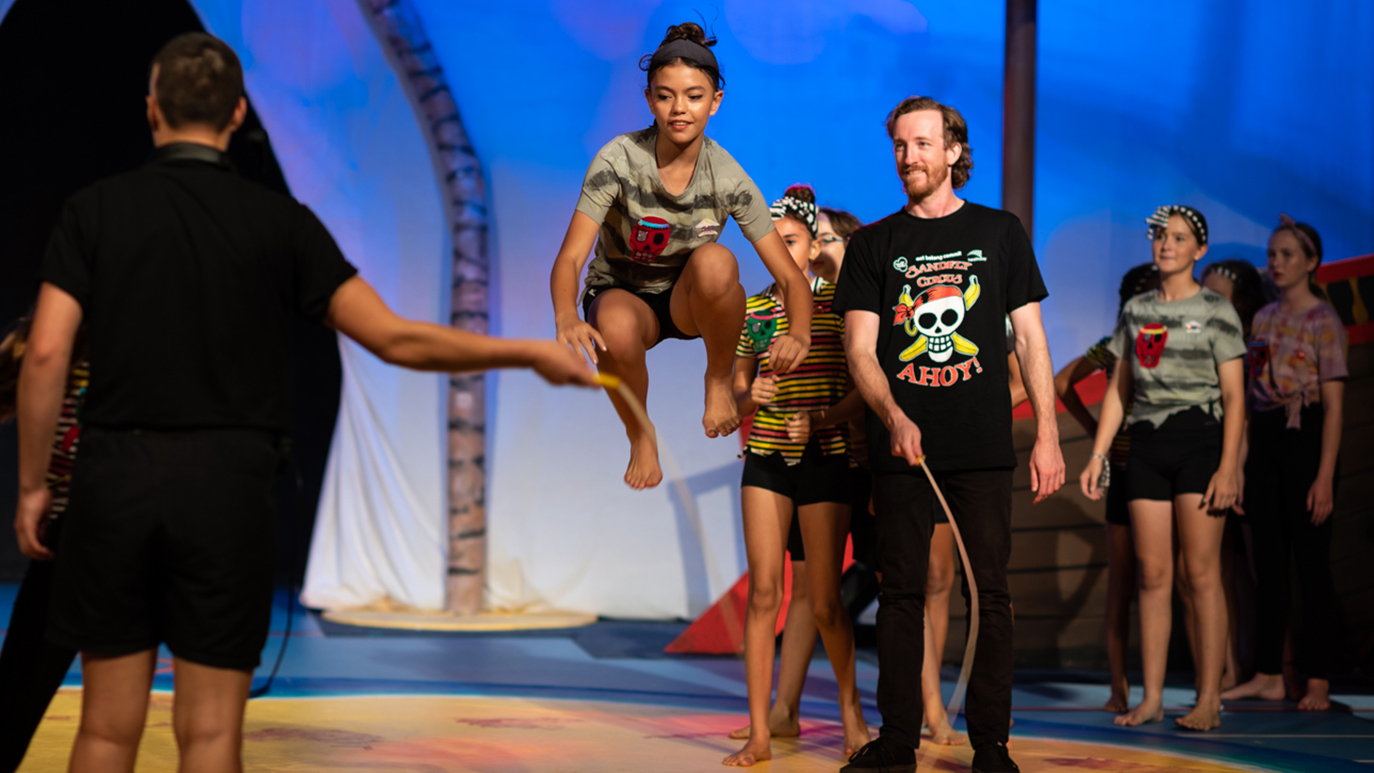 Sandfly performers skip through a scene of ‘Ahoy!’ by the Act Belong Commit Sandfly Circus. Theatre Kimberley, Broome, 2022. Photo by Robak Photography.