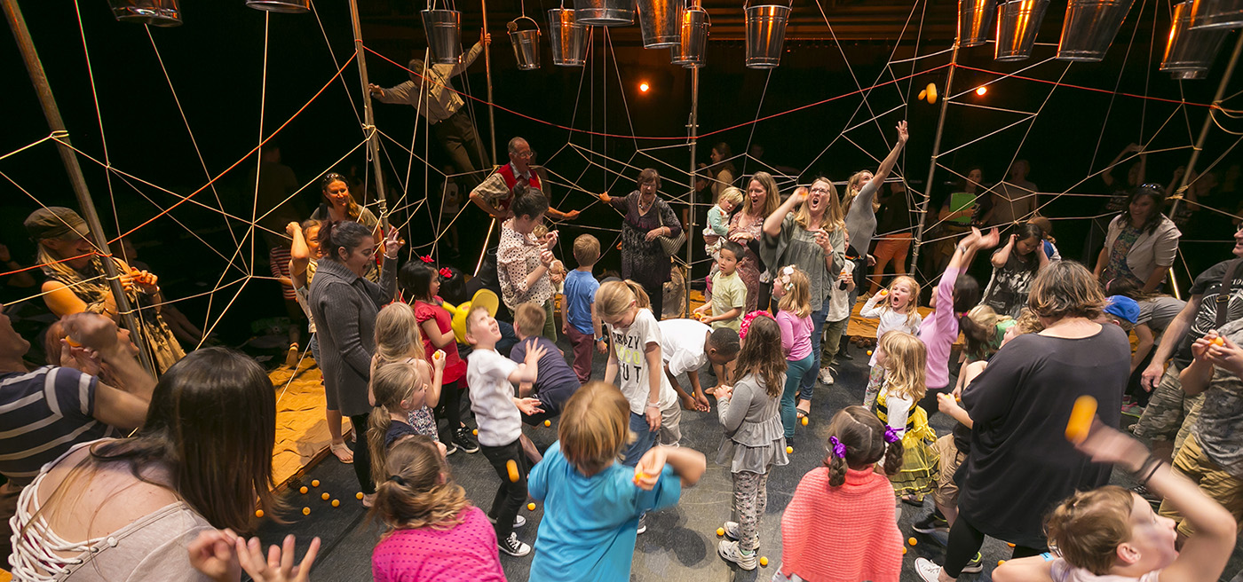 Kids and families playing together during a festival.