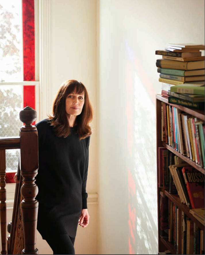 Joan London on a staircase