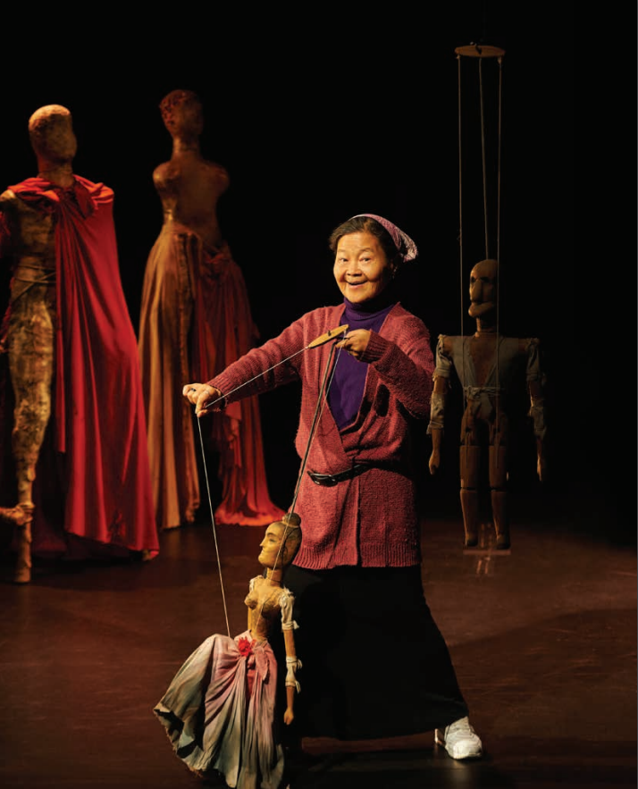 Noriko Nishimoto playing with a puppet