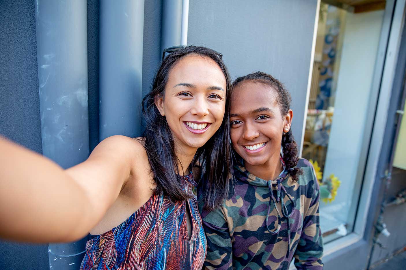 Aboriginal Australian Teenager walking through her city streets, with her mother, posing. Image:  Belinda Howell/Getty Images