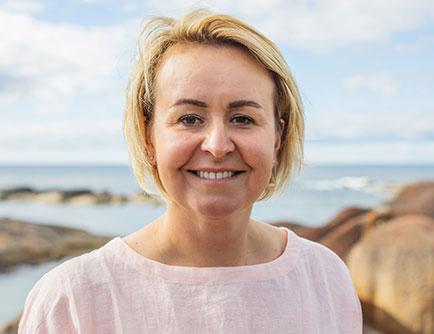 Portrait of Agata Sleeman with beach in the background