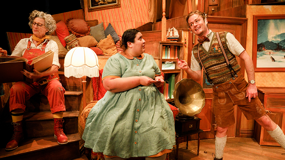 Three actors performing on a stage