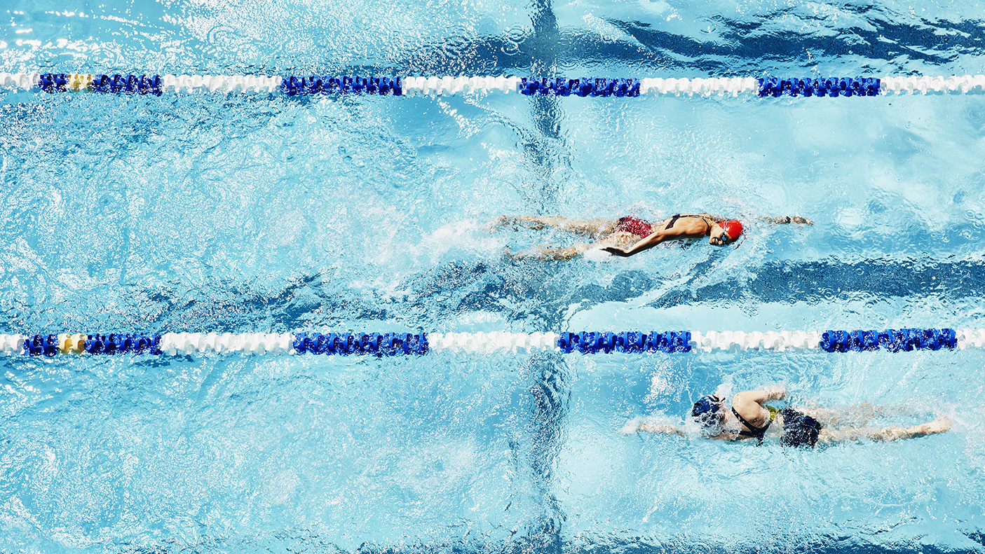 Swimmers doing laps in a 50 metre pool