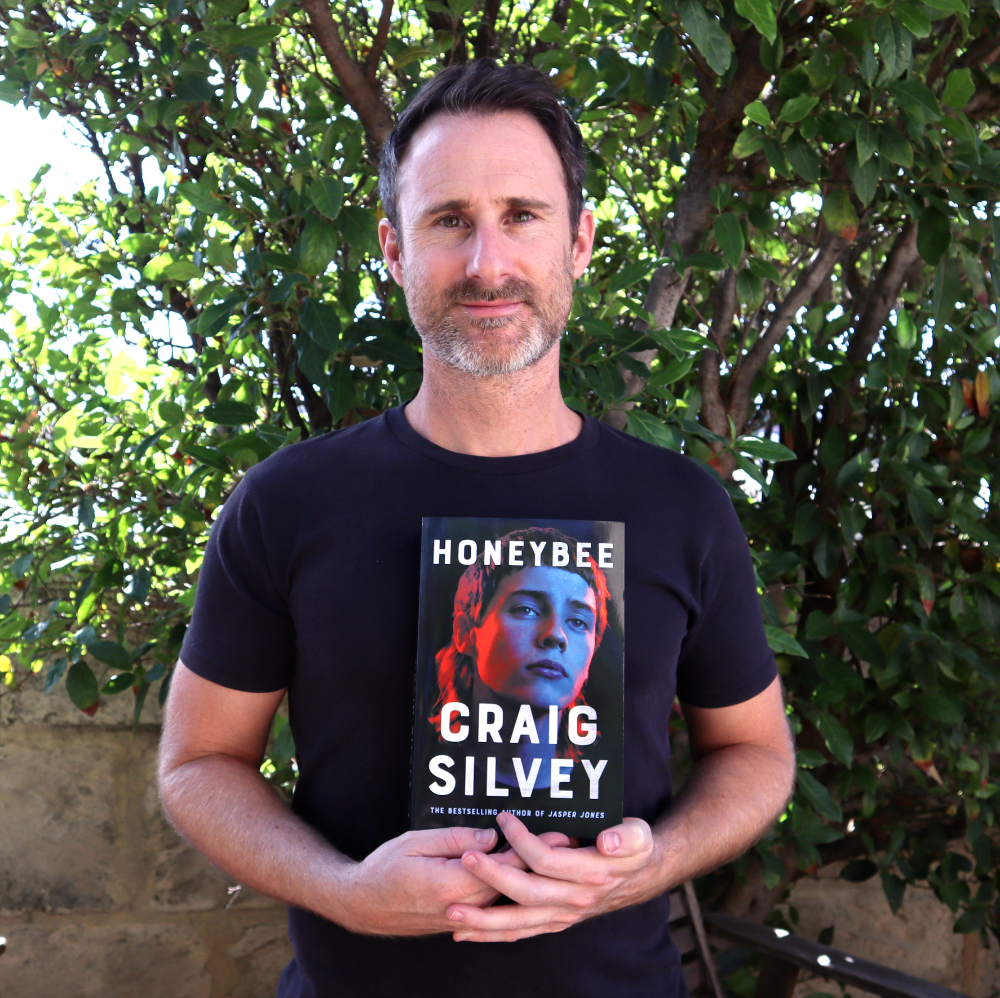 Craig Silvey, holding a copy of ‘Honeybee’. Photo by Craig Silvey.