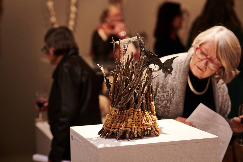 A woman looking at a sculpture