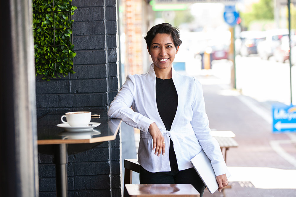 Portrait of confident business woman at coffee shop