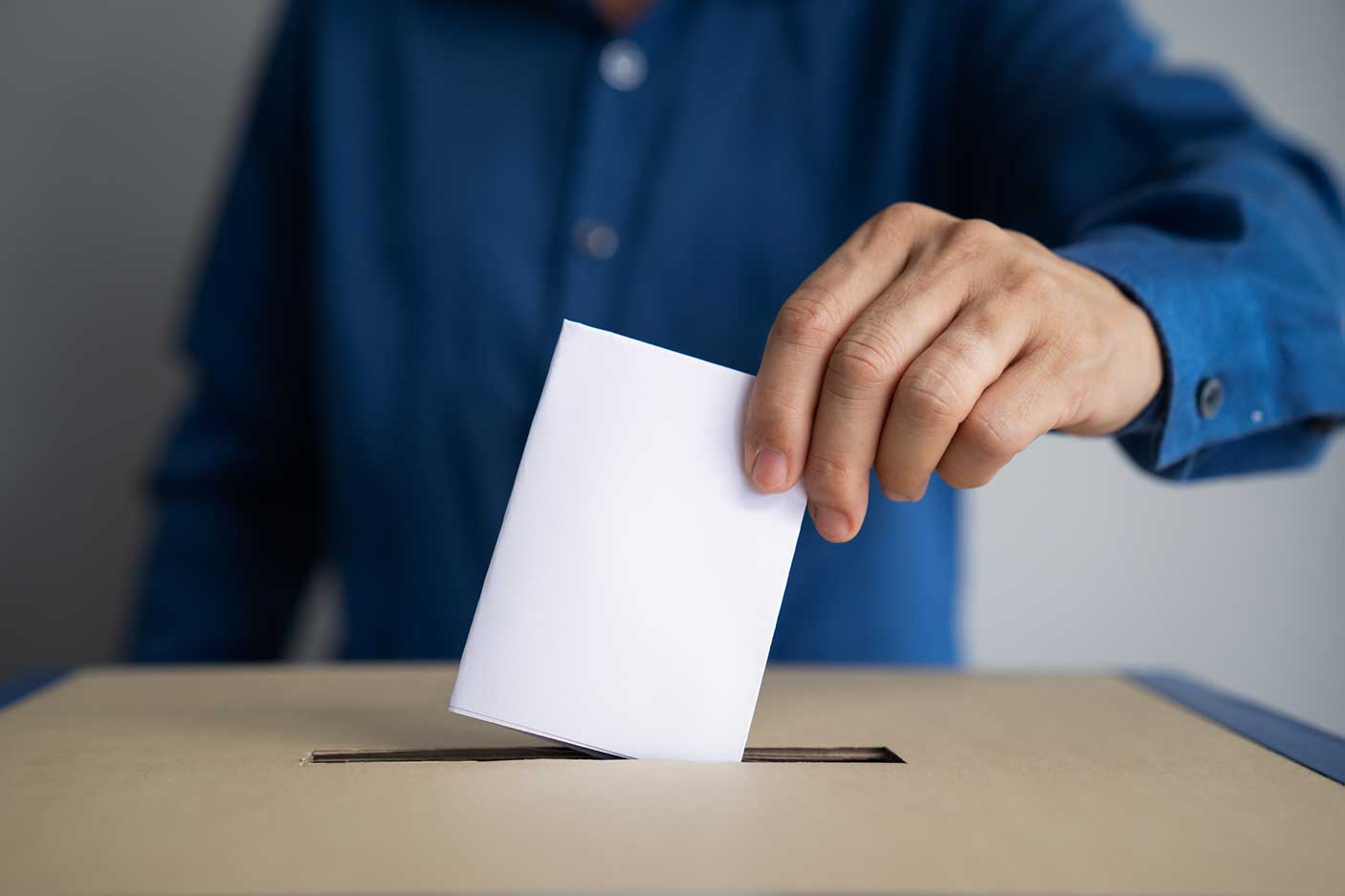 A person casting their vote