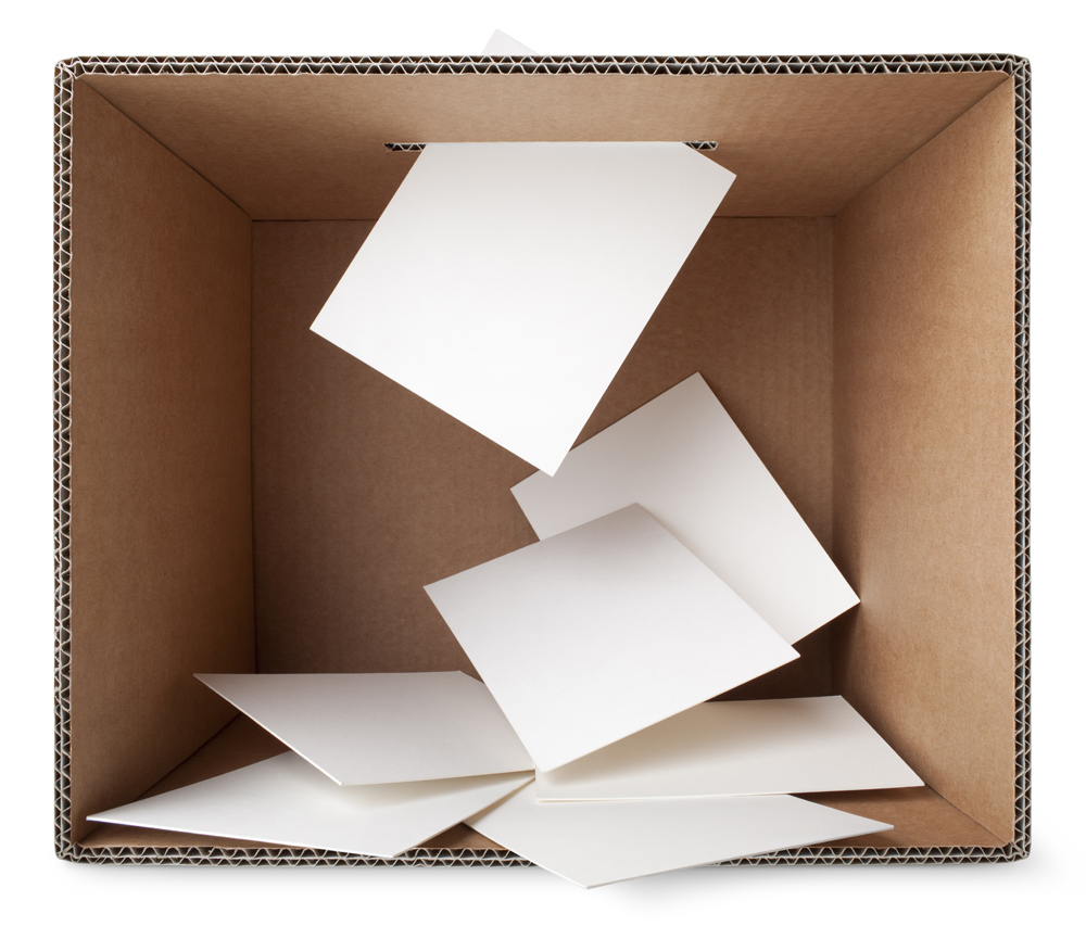 A cardboard box with ballot papers