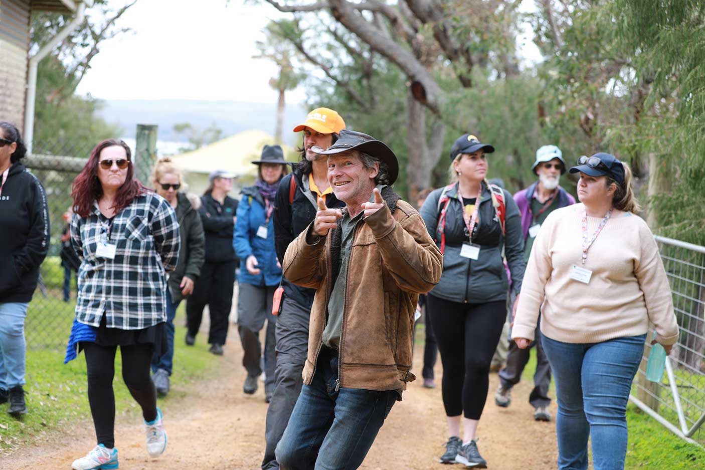 A group of people walking along a path