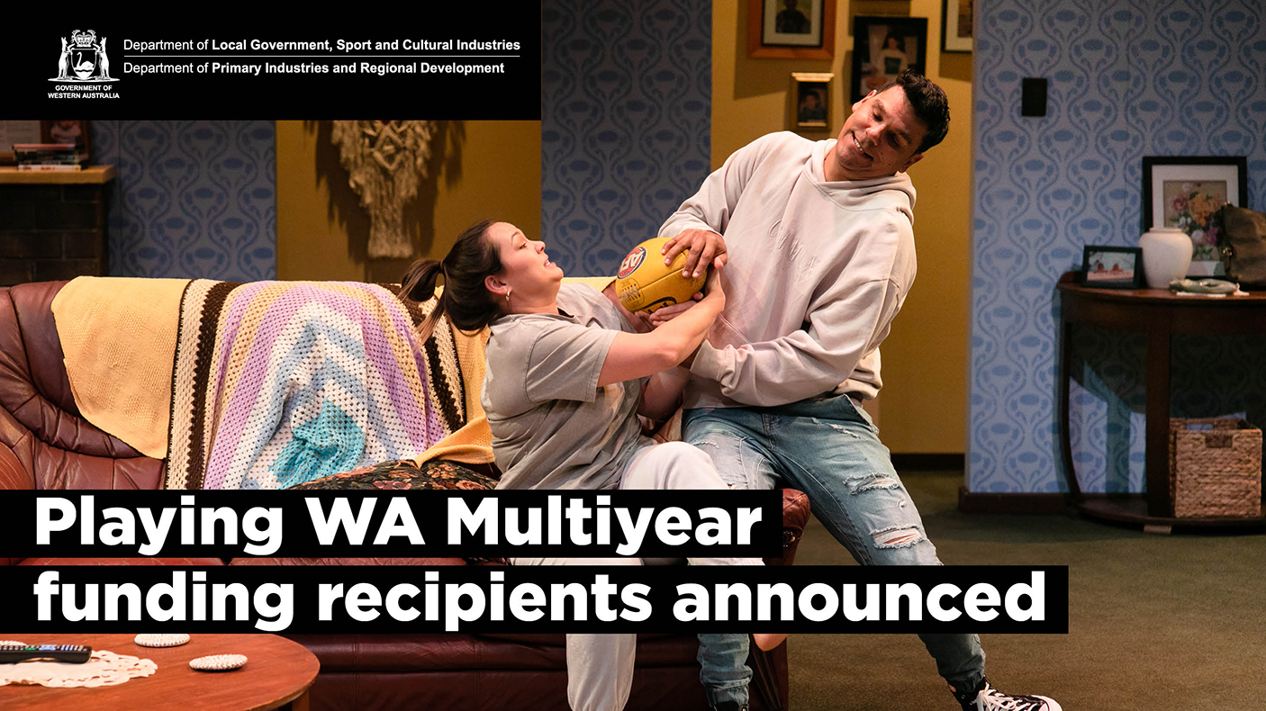 A man and a woman tussle over a ball in a scene from the Back Swan State Theatre Company production of Barracking for the Umpire.