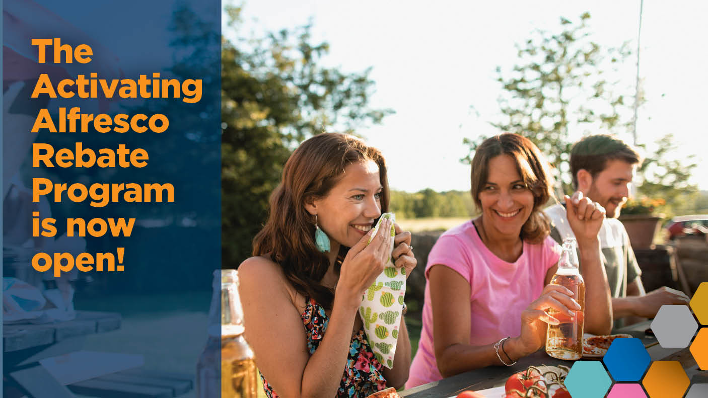 A group of people eating at a table outdoors