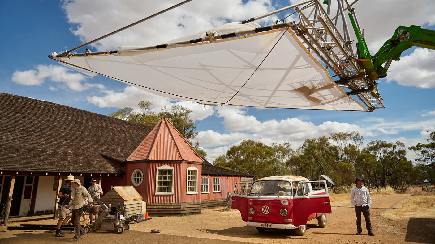 A film crew on an outdoor production set