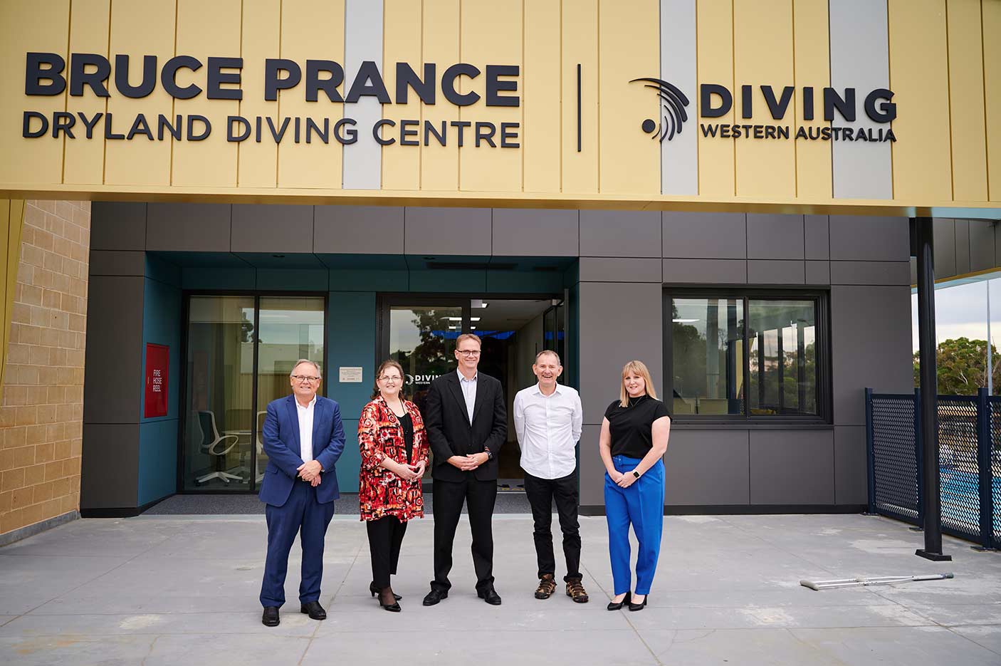 5 people standing in front of the Bruce Prance Dryland Diving Centre.