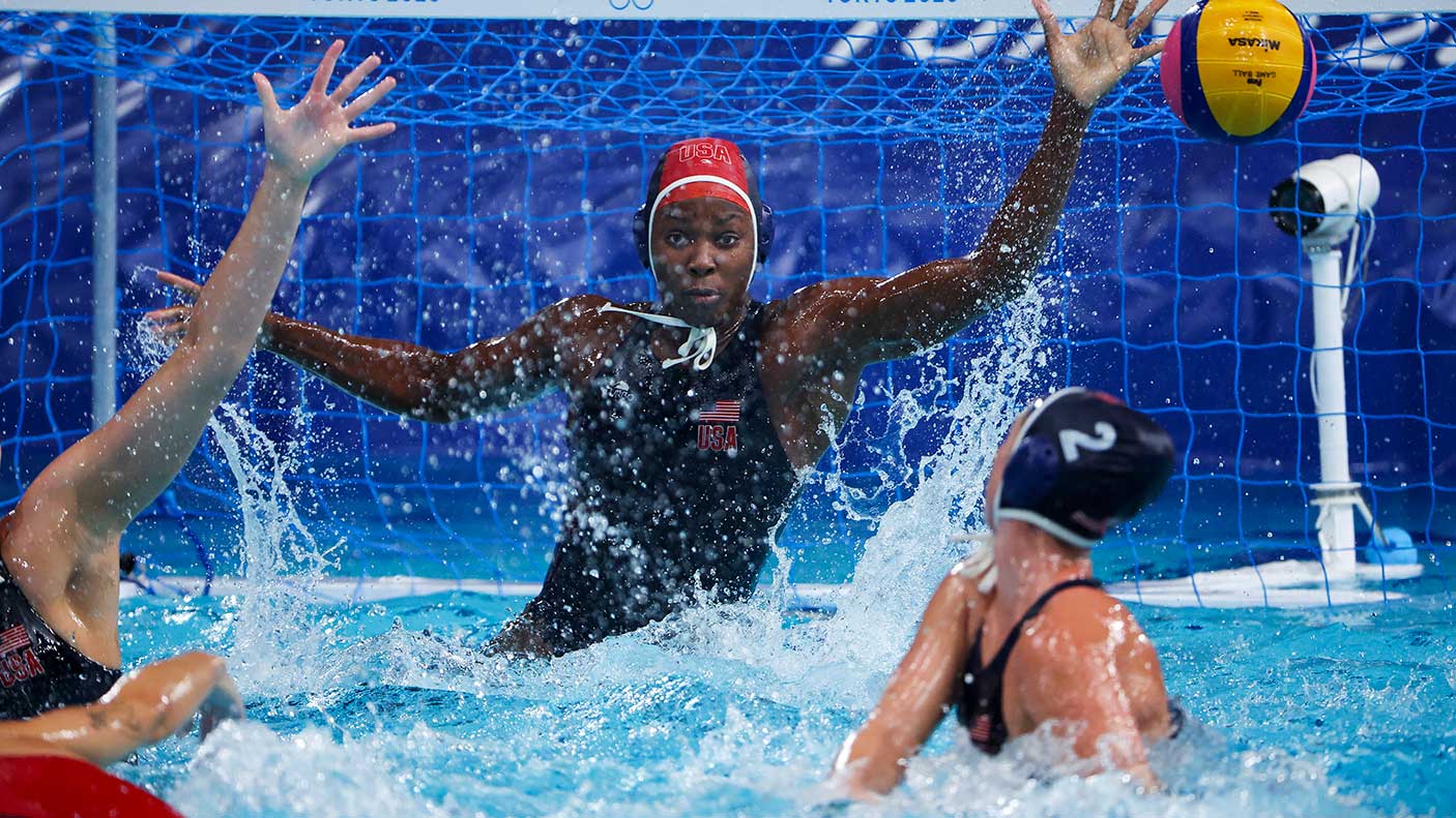 Water polo goalie in action saving a goal