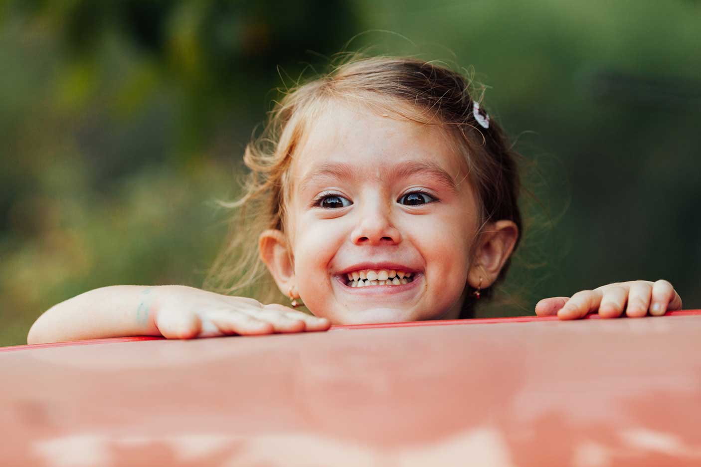 A girl looking happy and exciting in a playground