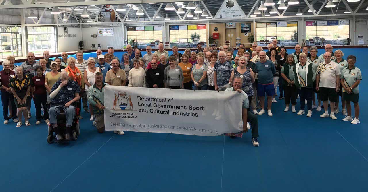 A group of people holding a banner