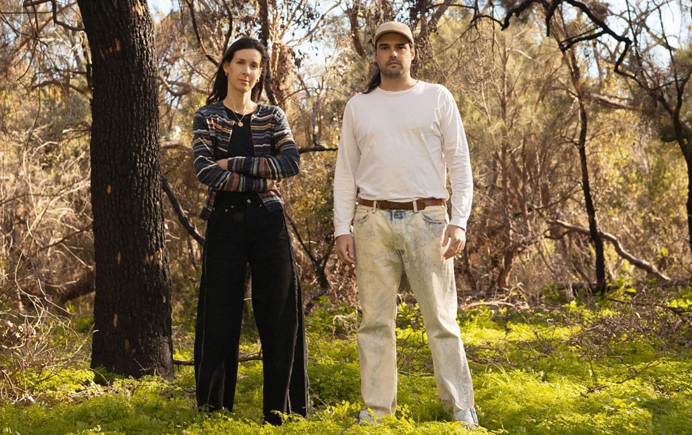 Actors Melanie Filler and Tim Barretto stand in the Australian bush.