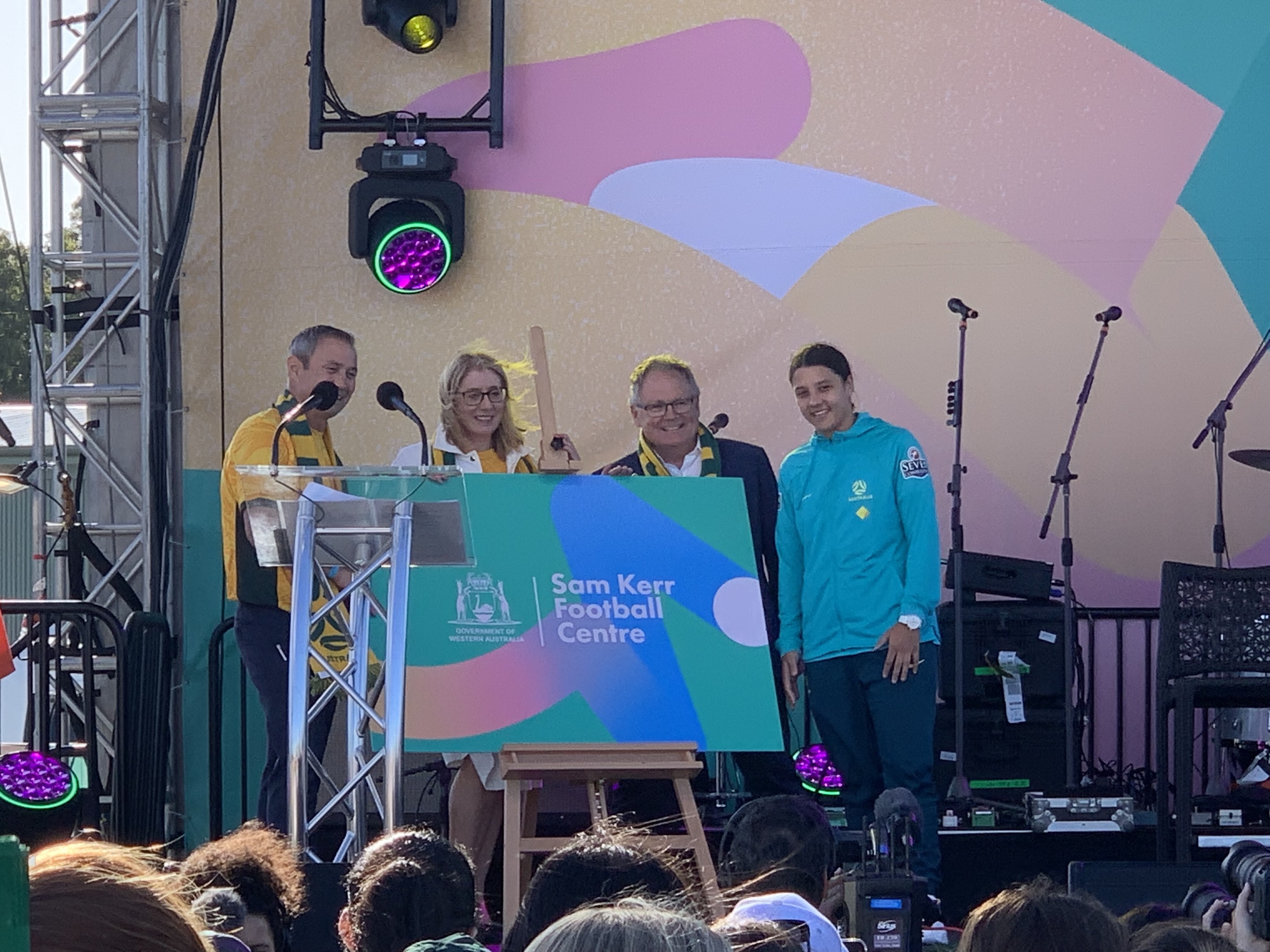 Premier Cook, Ministers Saffioti and Templeman and Sam Kerr in front of the Sam Kerr Football Centre corflute 