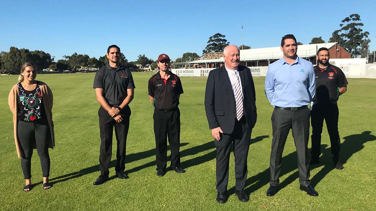 Minister joined by Nollamara football legend Des Headland and members of the Nollamara Football club