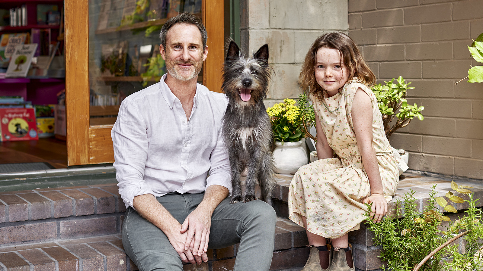 Author Craig Silvey with Lily LaTorre and Squid the grey dog.