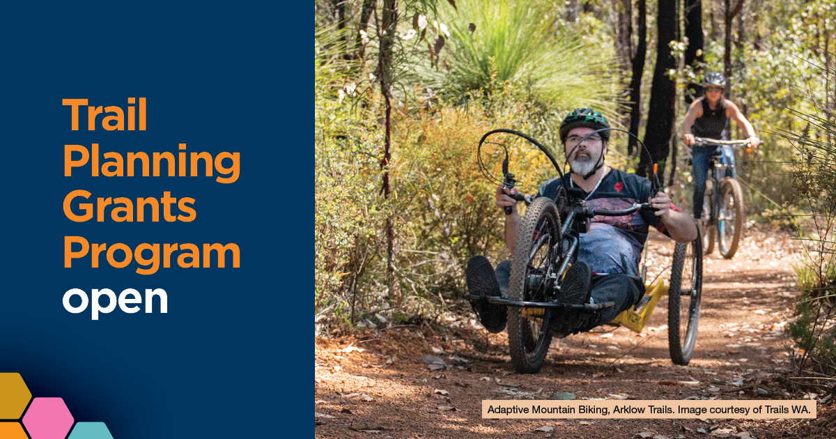 Trails Planning Grants Program open. Image of rider using a modified hand mountain bike on a trail.