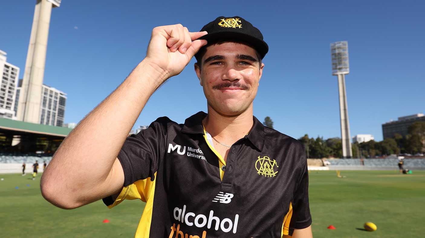 Teague Wyllie of Western Australia poses after receiving his cap during day one of the Sheffield Shield match between Western Australia and Victoria at the WACA