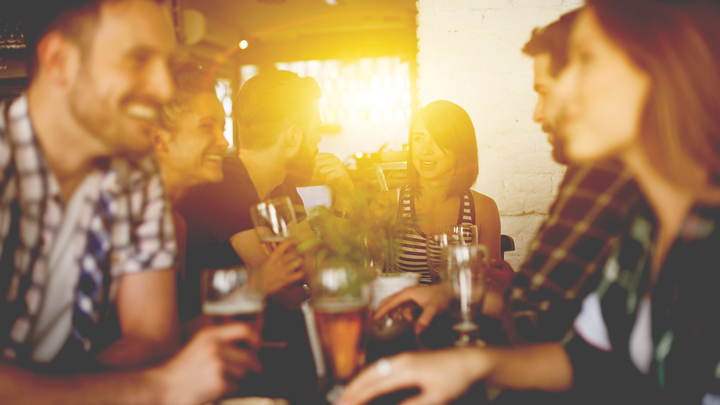 A group of friends met up at a pub for a drink after a long and busy day.