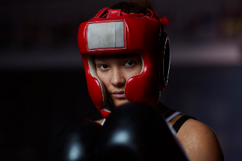 Portrait of teenage athletic boxing girl - stock photo
