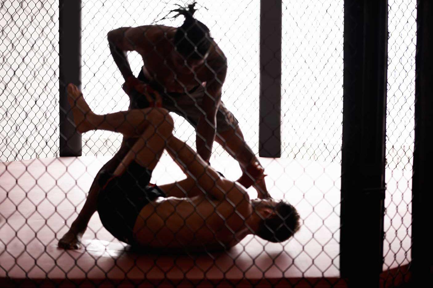 Shot of a two young man sparring in a ring