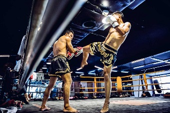 Muay Thai athletes training on the boxing ring