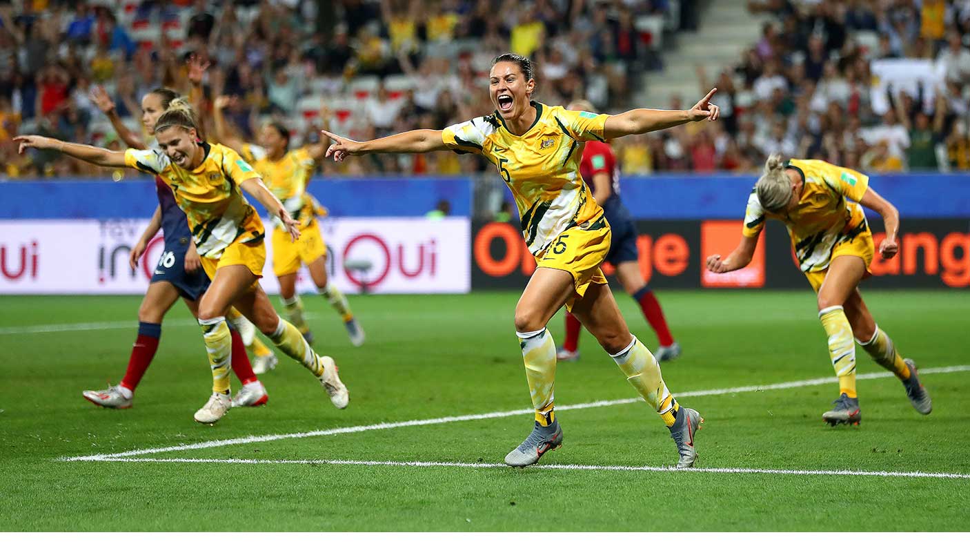 Football players celebrating after a win at a World Cup match