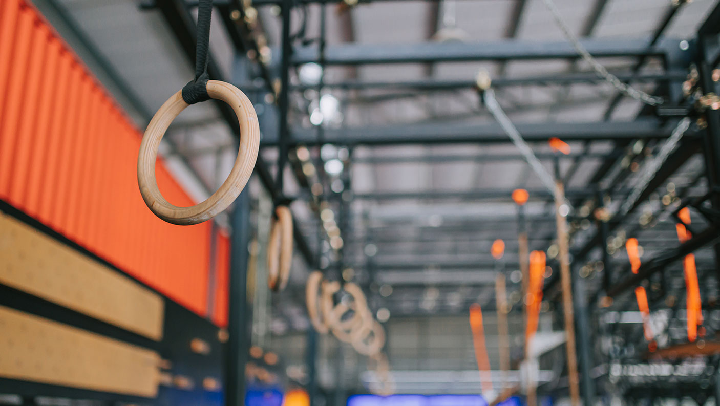 An indoor gymnastics studio with gymnastics training equipment.