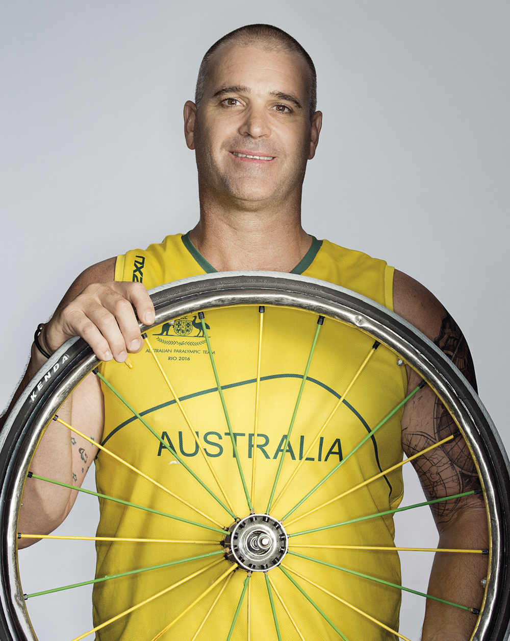 Portrait of Brad Ness holding a wheel