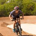 A boy on a bike on the pump track