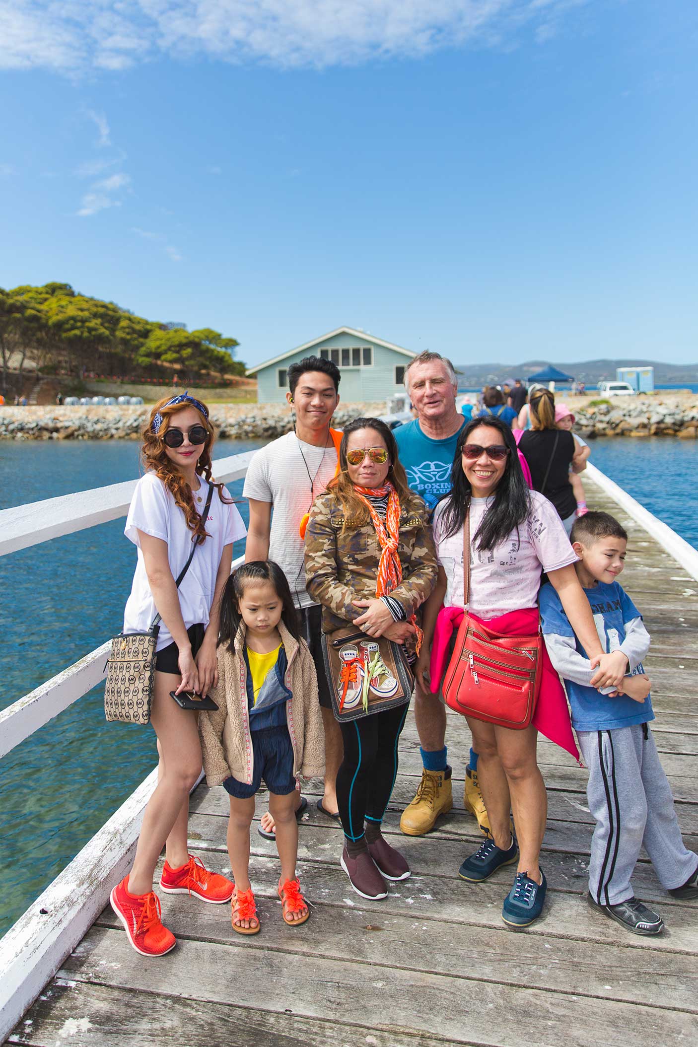 A family on the jetty at Camp Quaranup