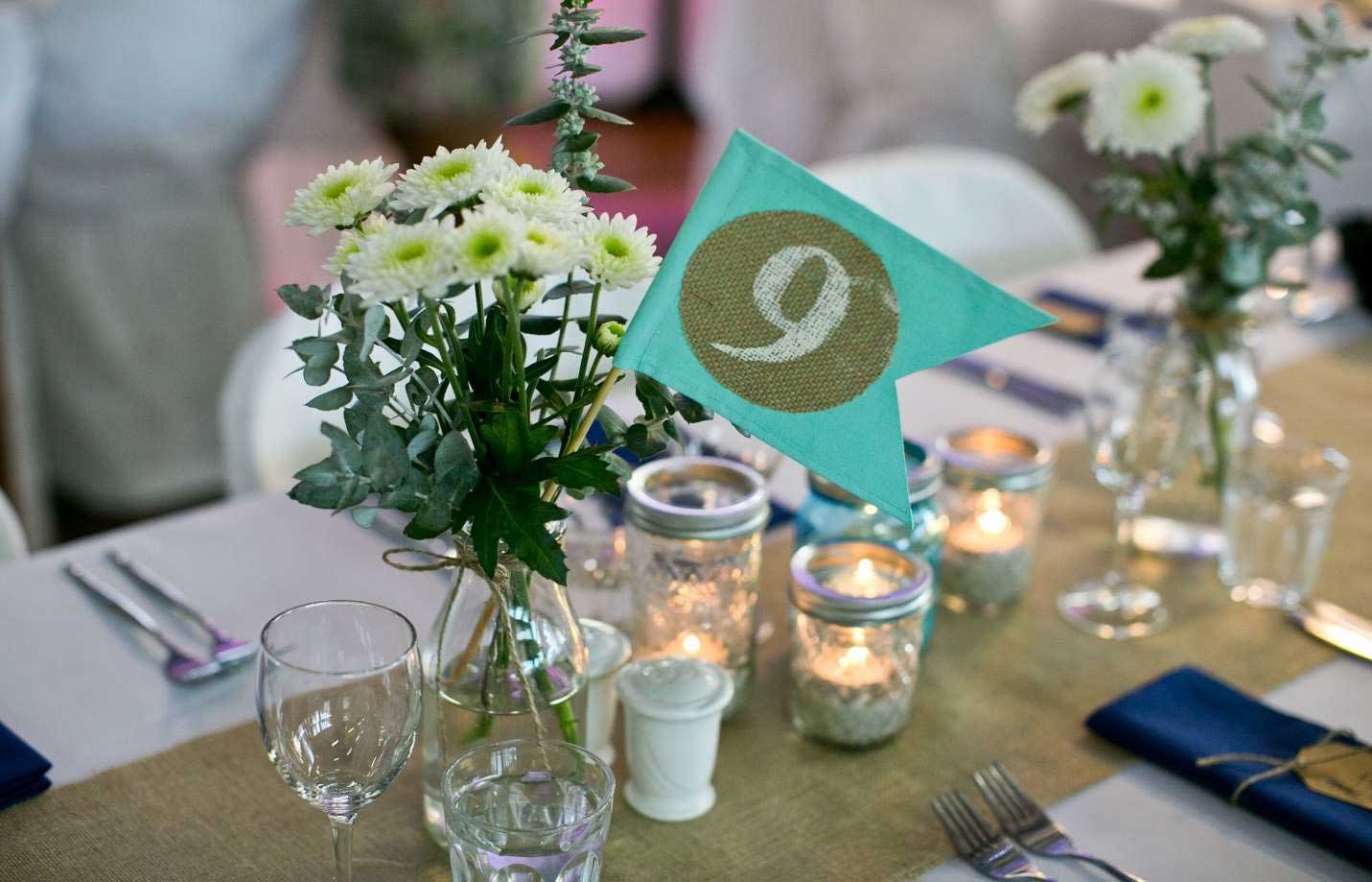 A close up image of a table decoration at a wedding